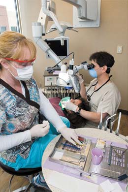 Dental staff working with tools